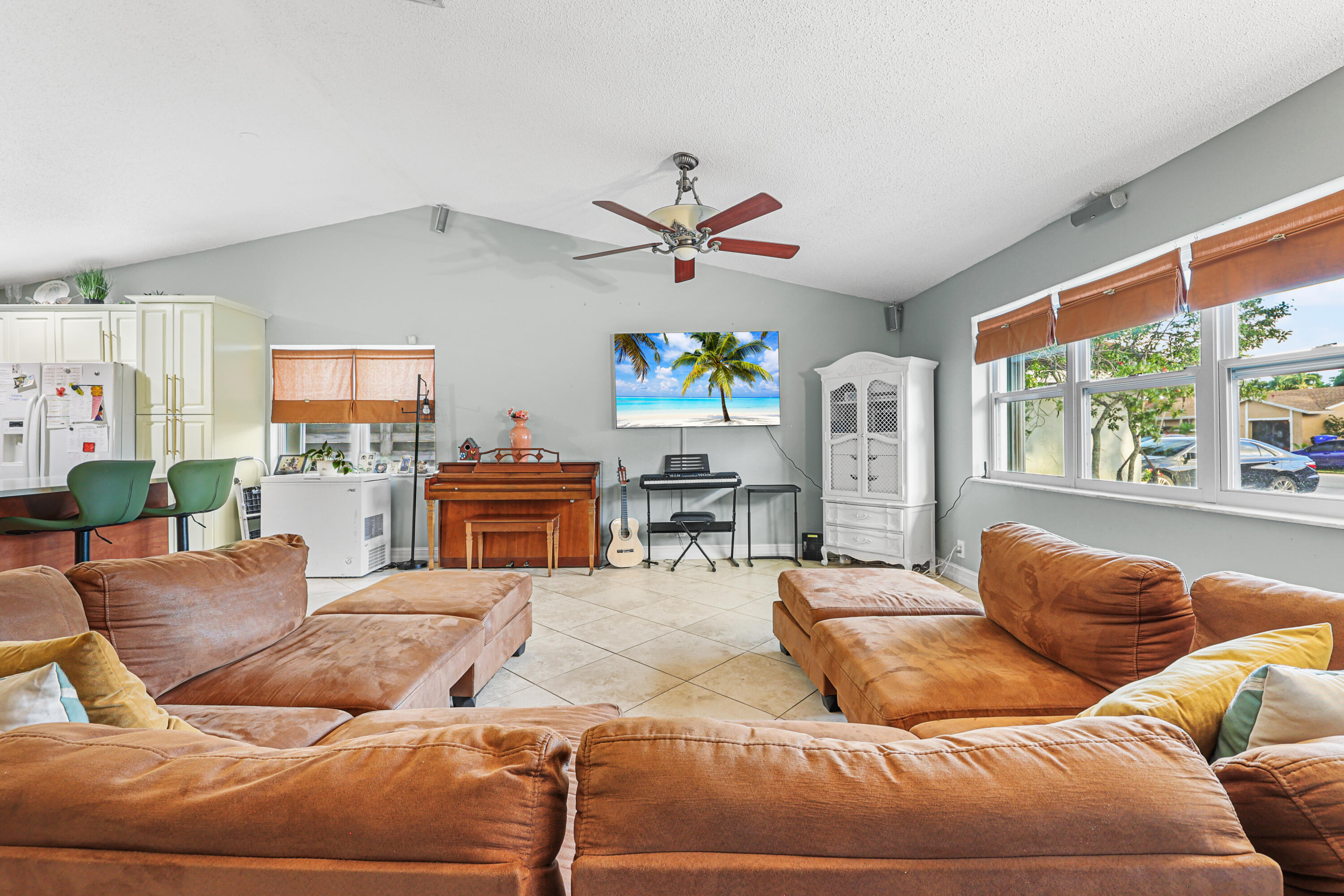7527 Southwest 7th Street North Lauderdale, FL 33068 - Photo 20 of 34 a living room with furniture ceiling fan and a large window
