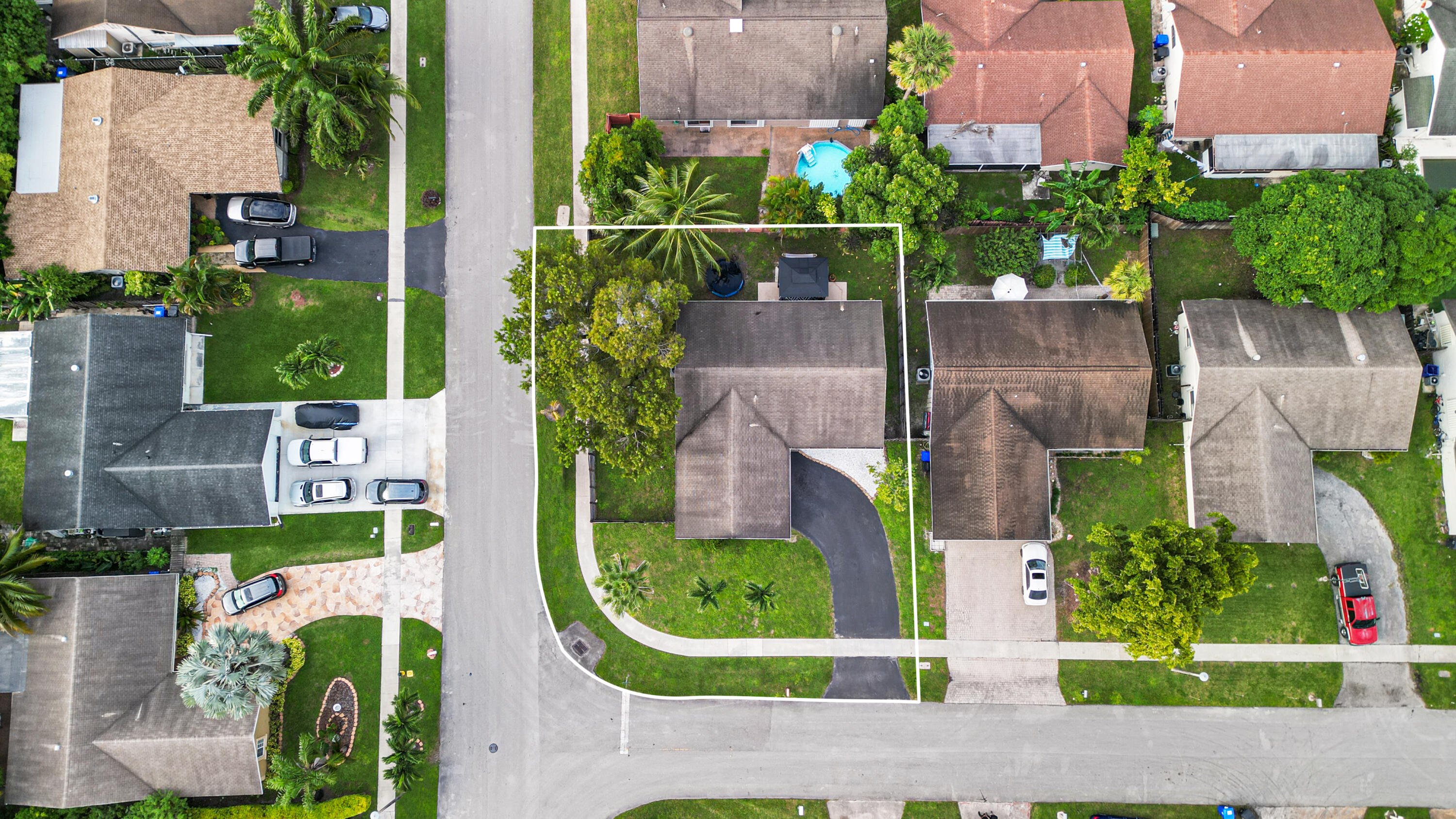 7527 Southwest 7th Street North Lauderdale, FL 33068 - Photo 3 of 34 an aerial view of a house with a garden and trees