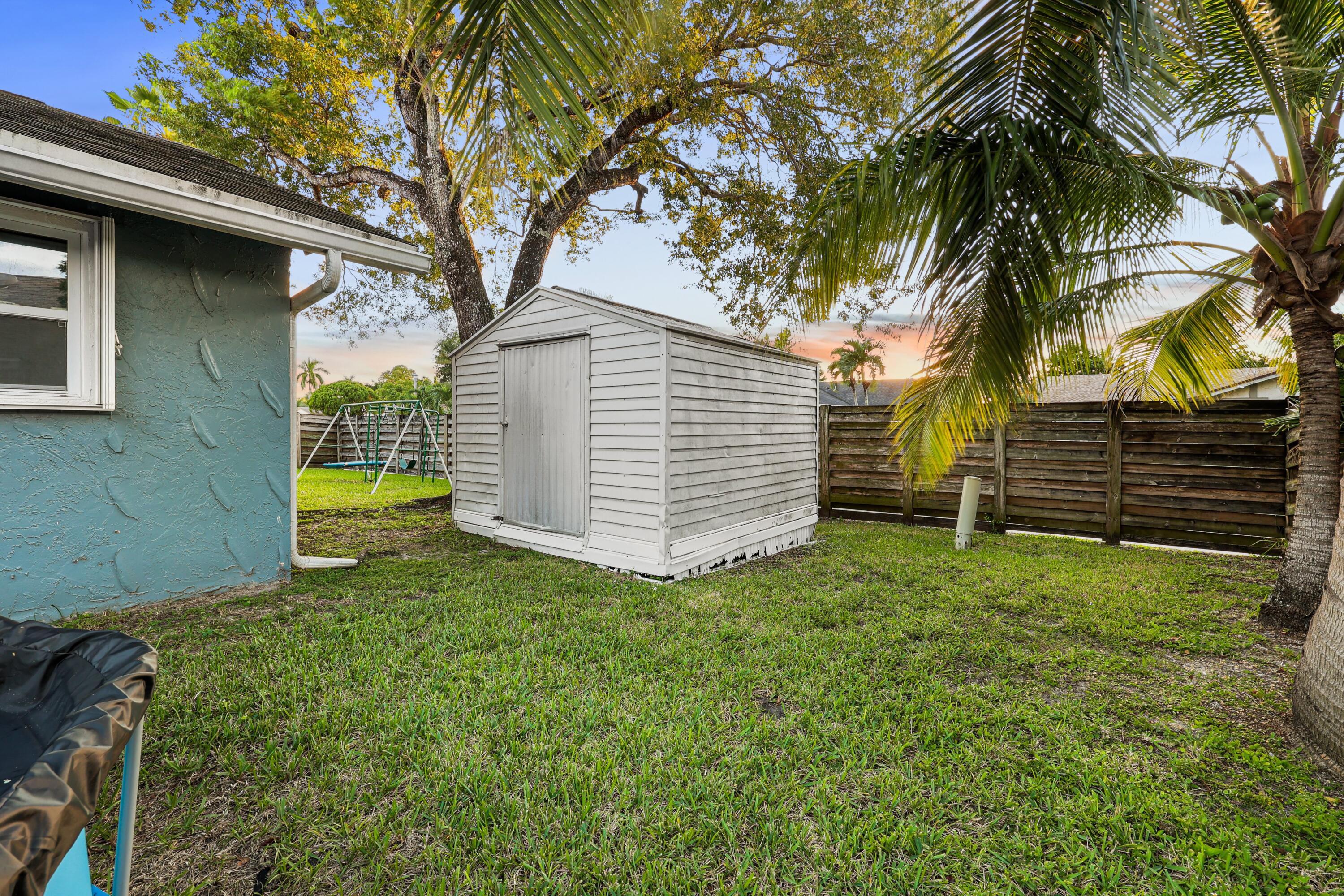 7527 Southwest 7th Street North Lauderdale, FL 33068 - Photo 31 of 34 a view of a backyard with a tree