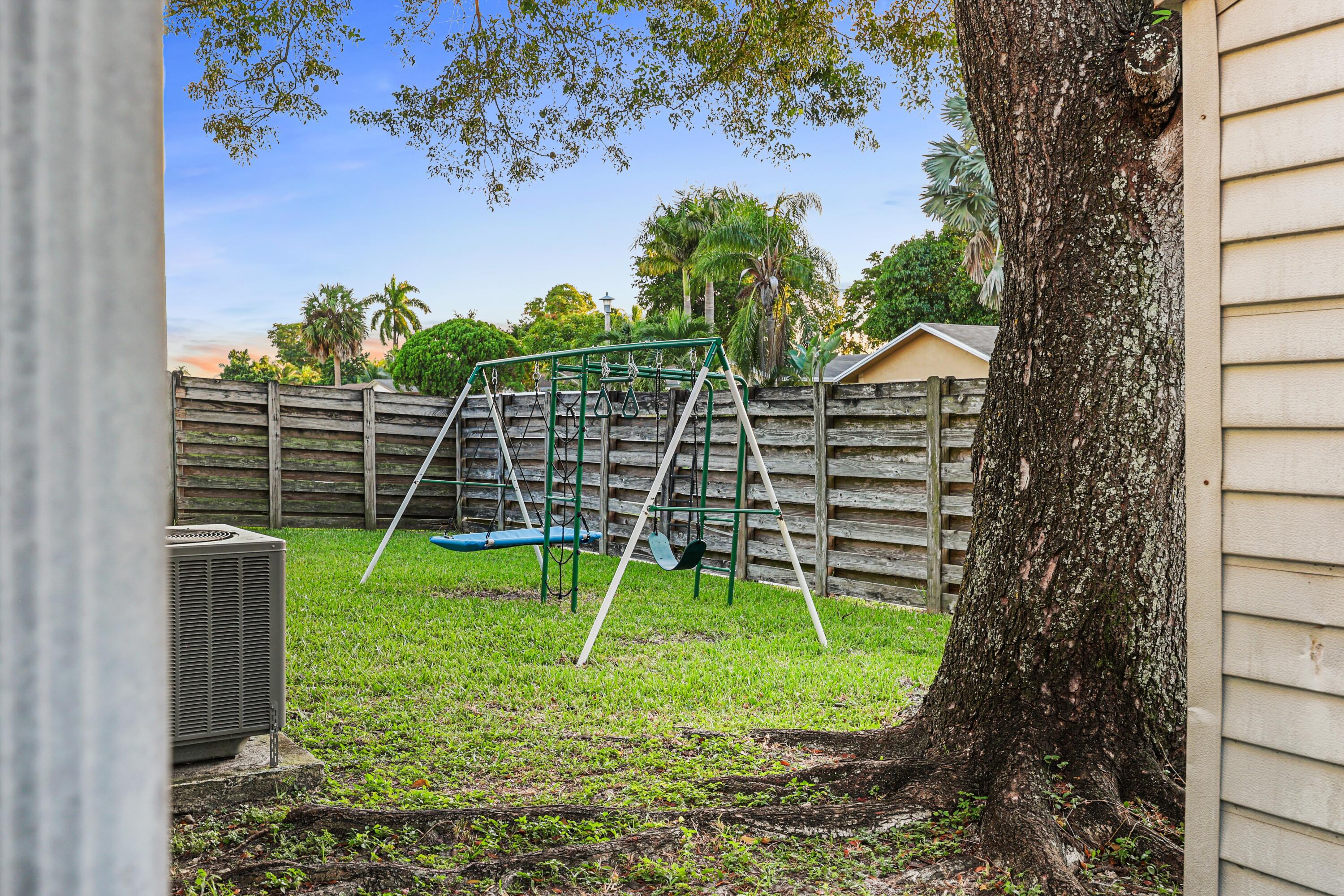 7527 Southwest 7th Street North Lauderdale, FL 33068 - Photo 32 of 34 a view of a backyard with a slide