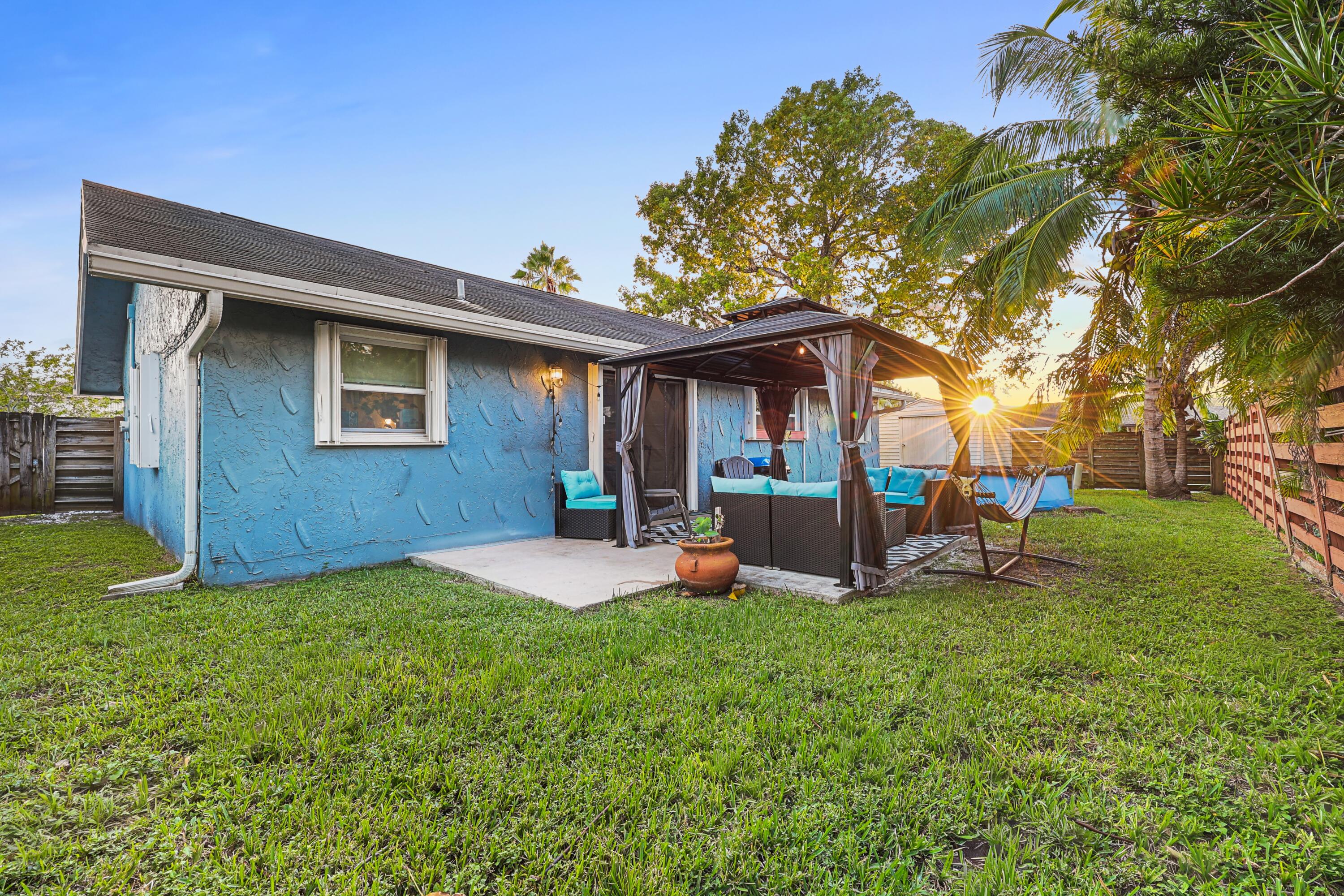 7527 Southwest 7th Street North Lauderdale, FL 33068 - Photo 33 of 34 a view of a house with backyard porch and sitting area