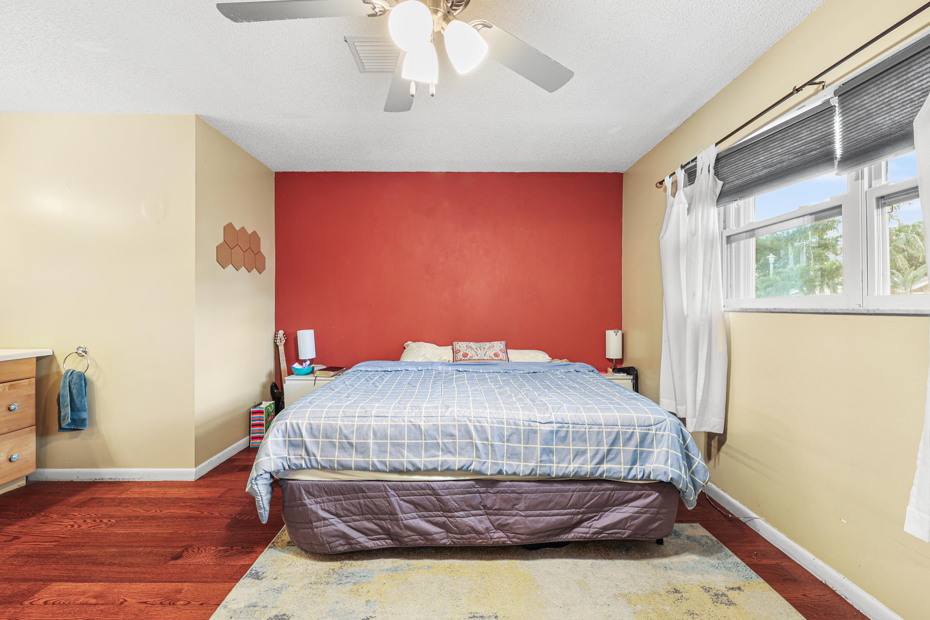 7527 Southwest 7th Street North Lauderdale, FL 33068 - Photo 7 of 34 a bedroom with a bed and wooden floor