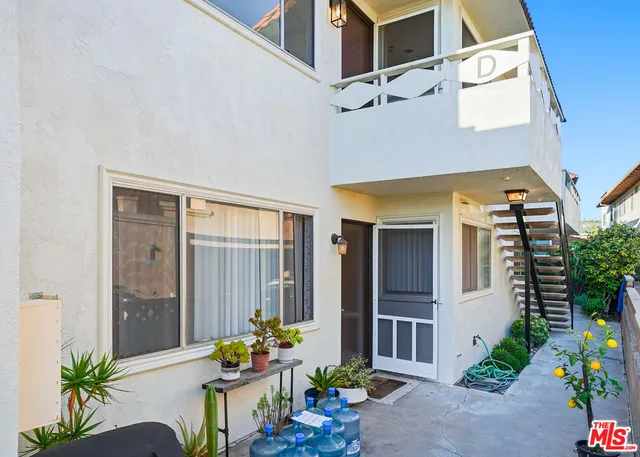 a dining room with furniture and flowers