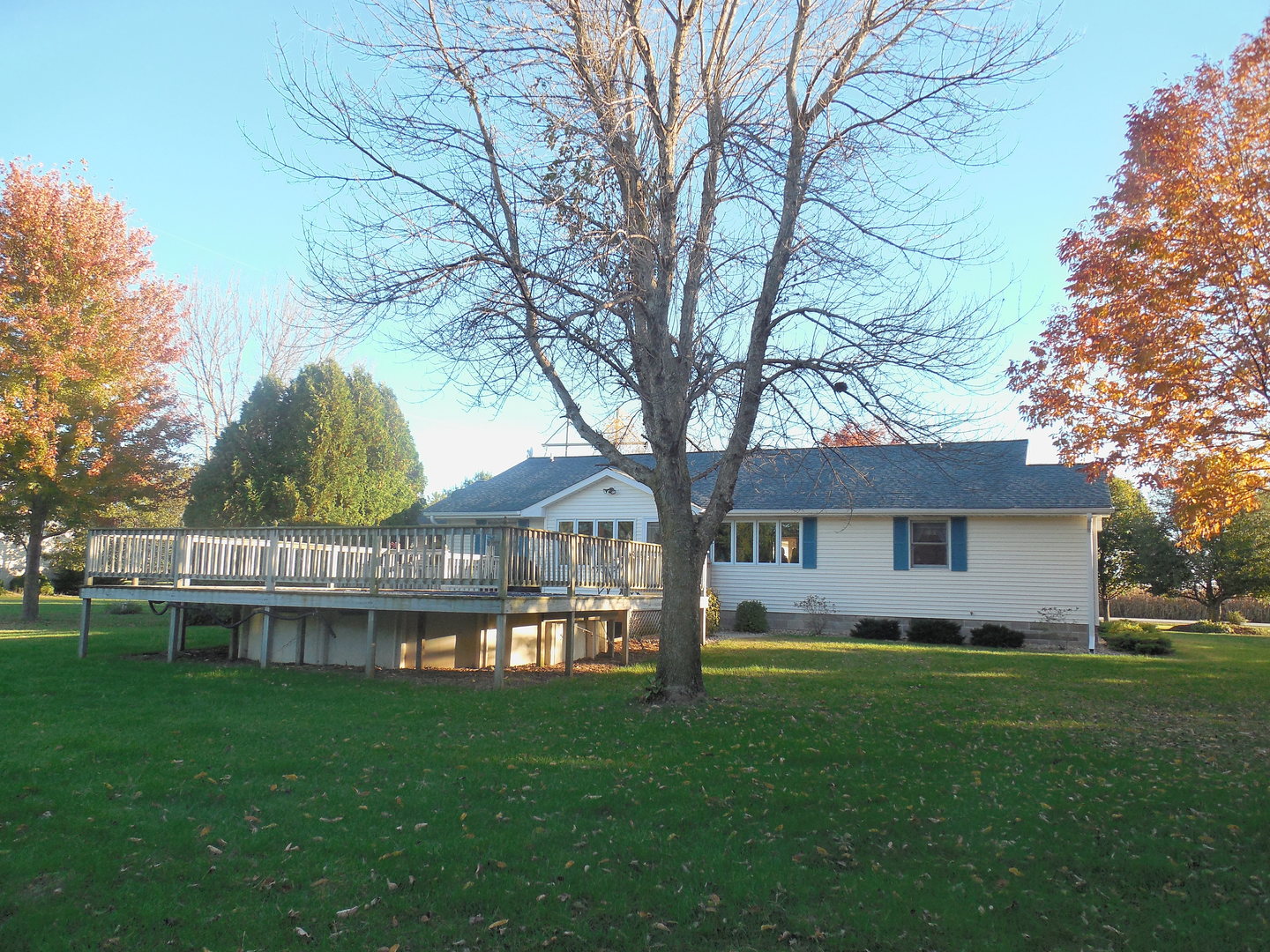 6472 Penrose Road Fulton, IL 61252 - Photo 2 of 21 a view of a house with a backyard and a tree
