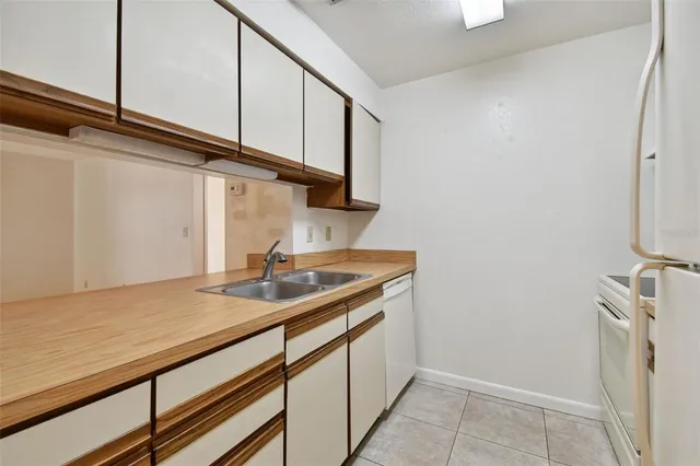a kitchen with a refrigerator and a cabinets