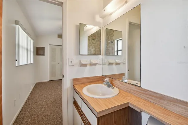 a view of an empty room with a window