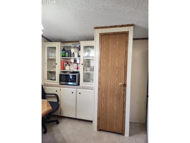 a room with cabinets and window