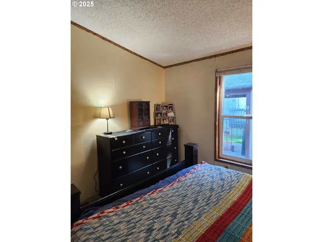 a room with a dresser and a mirror