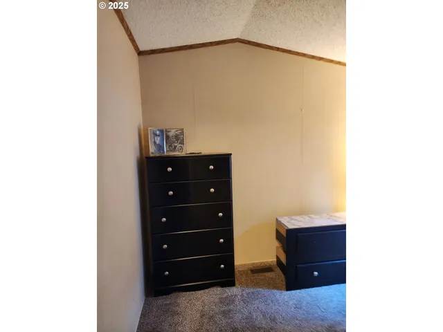 a room with a cabinet and a table