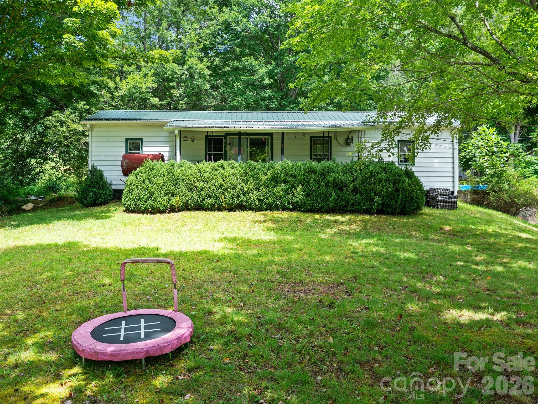 2216 Beans Creek Road Bakersville, NC 28705 - Photo 39 of 39 a view of a backyard with table and chairs