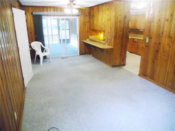 a view of a livingroom with furniture and window
