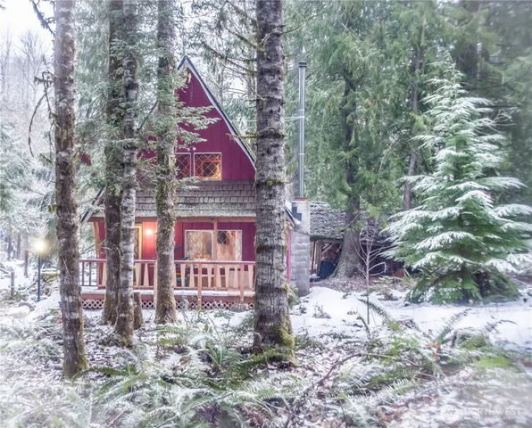 a aerial view of a house with a yard