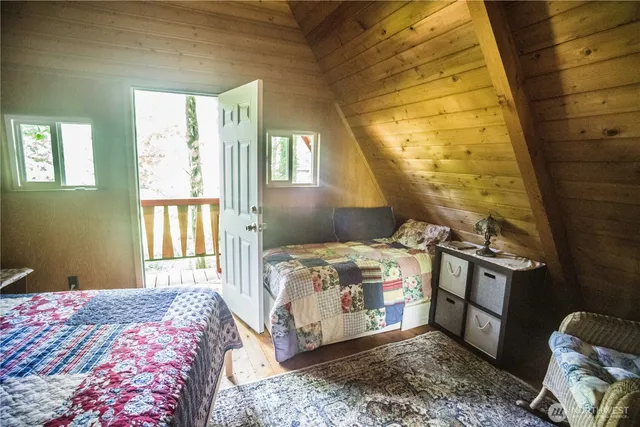 a bedroom with a bed and a table