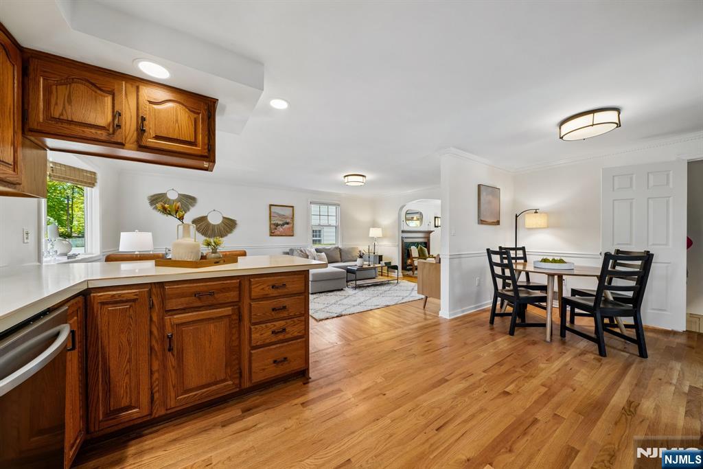 99 Ferncliff Road Bloomfield, NJ 07003 - Photo 14 of 30 a large living room with stainless steel appliances granite countertop wooden floor a dining table and chair