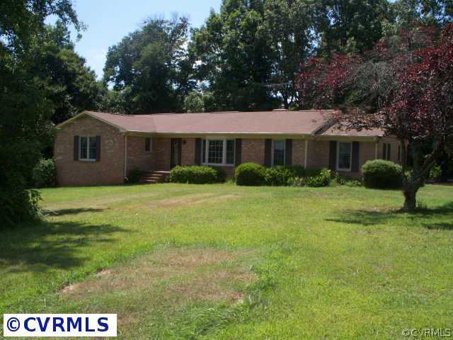 151 Wilson Farm Road Keysville, VA 23947 - Photo 1 of 10 a view of house in front of a big yard with large trees