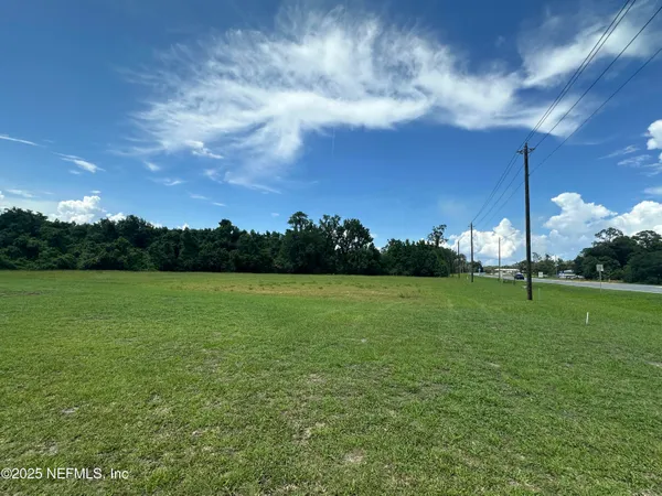 a view of a field with an outdoor space