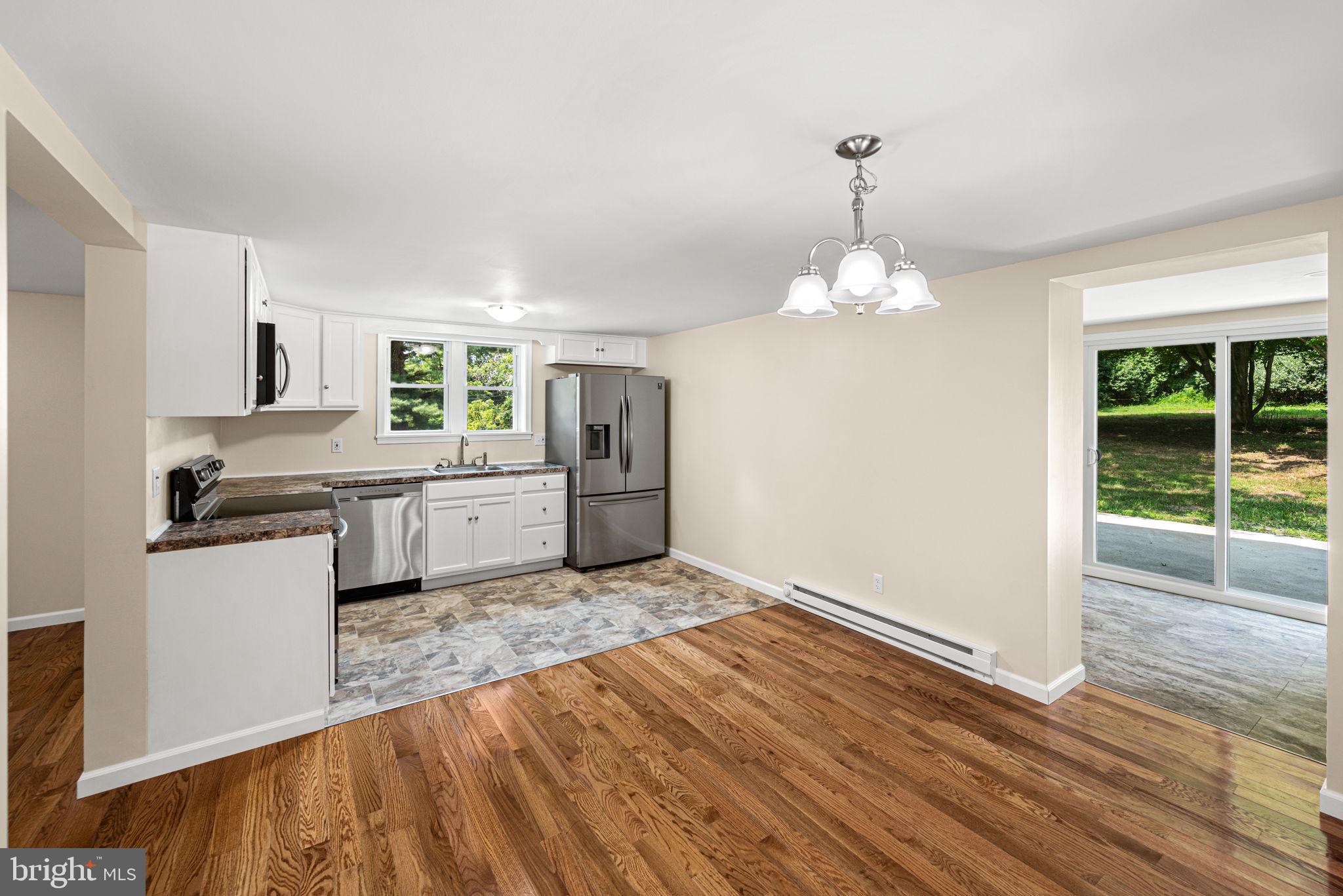 1430 South Manor Road Coatesville, PA 19320 - Photo 14 of 30 Kitchen Dining to Back Room with Full Bath