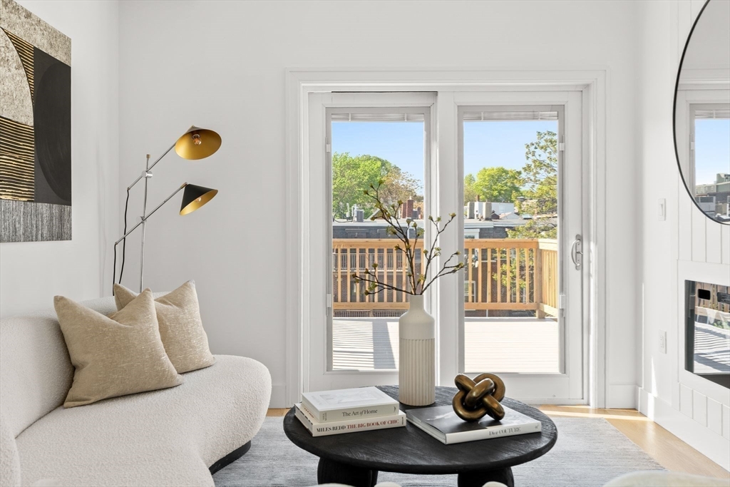 100 Bennington Street, Unit PH4A Boston, MA 02128 - Photo 17 of 41 a living room with furniture and a window