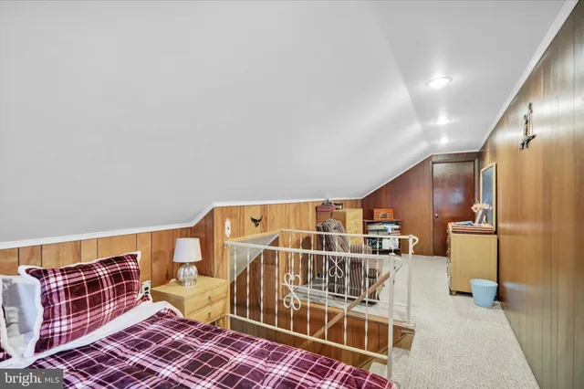 a utility room with lots of wooden furniture and a rug