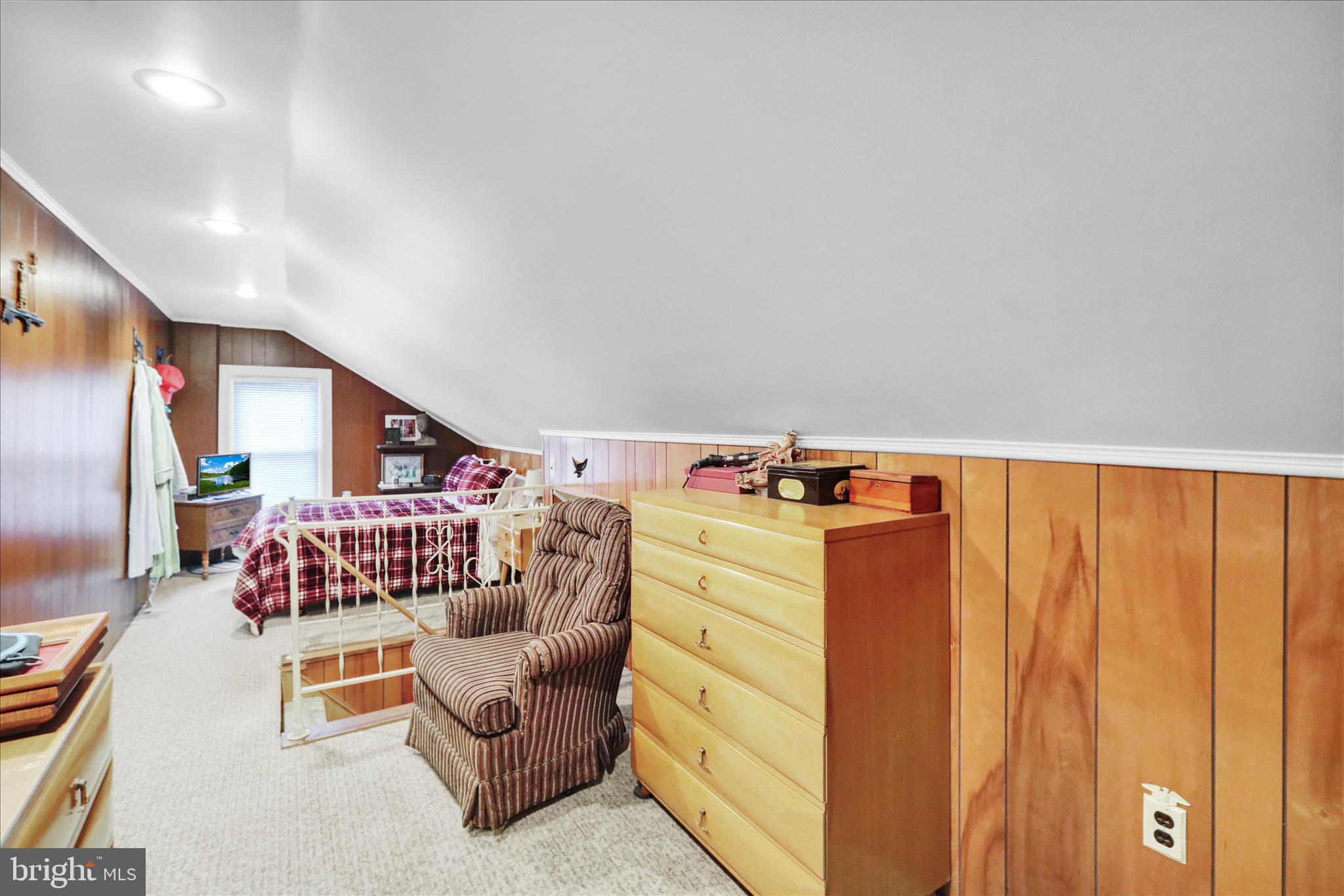 21 Woodland Road Reading, PA 19610 - Photo 22 of 39 a bedroom with a bed and a couch