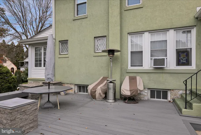 a view of a patio with chairs and a table