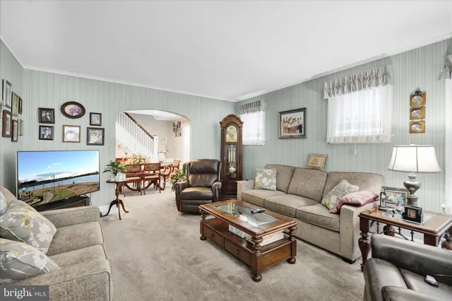 a living room with furniture or couch and a lamp