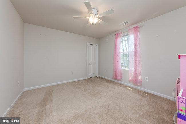 2082 Mallard Lane Locust Grove, VA 22508 - Photo 15 of 32 an empty room with windows and fan