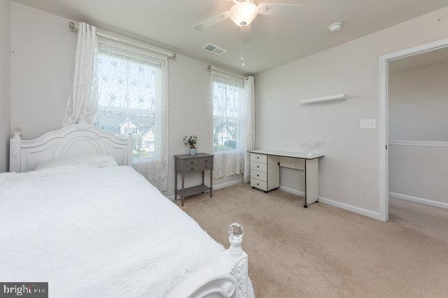 2082 Mallard Lane Locust Grove, VA 22508 - Photo 24 of 32 a spacious bedroom with a bed and a window