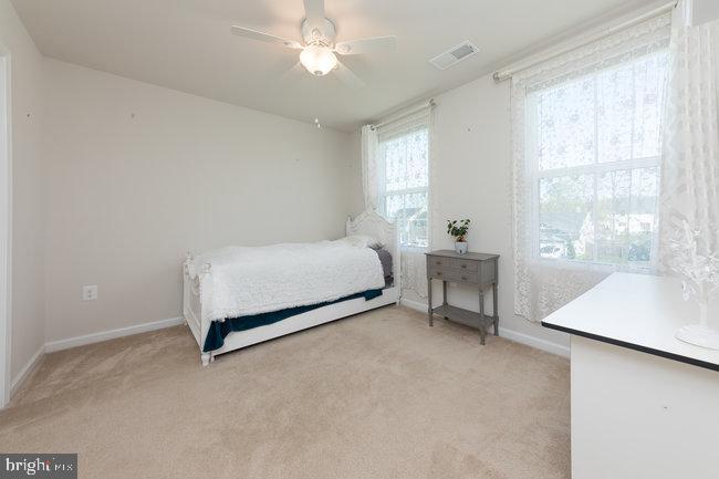 2082 Mallard Lane Locust Grove, VA 22508 - Photo 25 of 32 a bedroom with a bed and a window