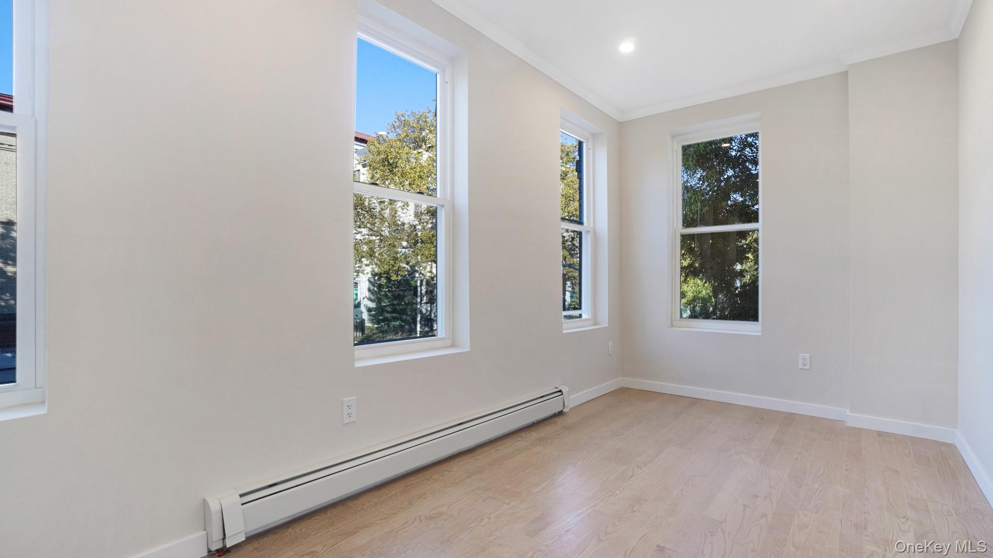 386 Chauncey Street, Unit 1 Brooklyn, NY 11233 - Photo 5 of 11 an empty room with windows