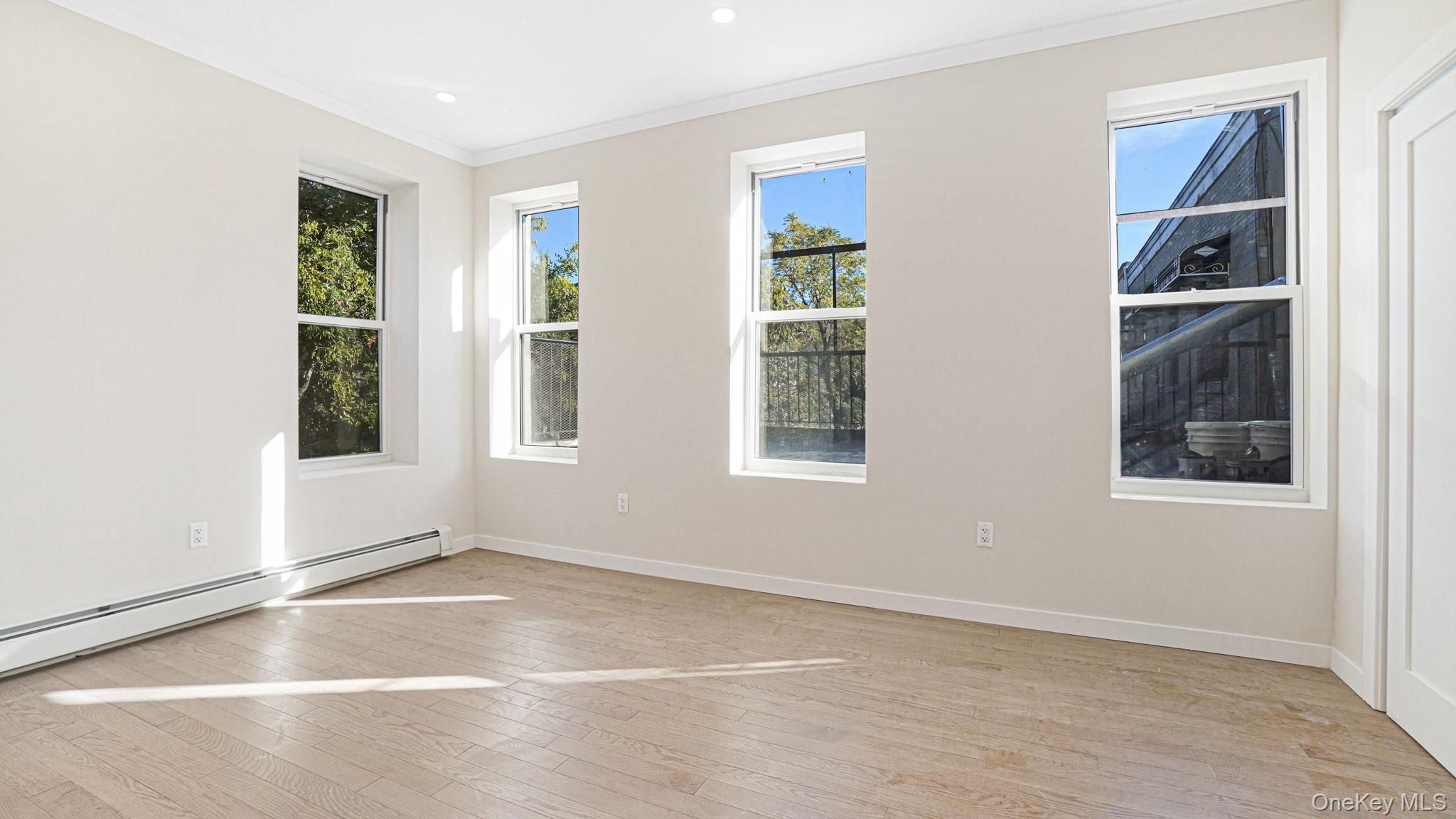 386 Chauncey Street, Unit 1 Brooklyn, NY 11233 - Photo 9 of 11 an empty room with windows