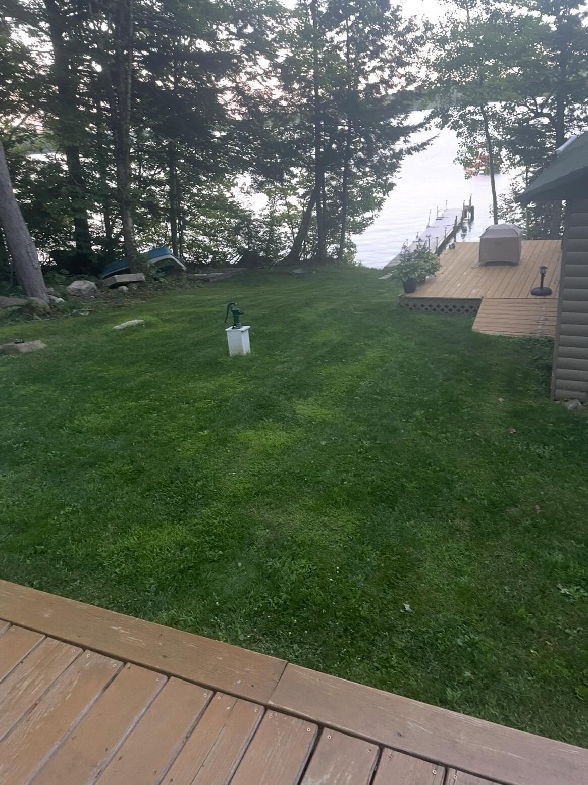 175 Azwelikit Road Casco, ME 04015 - Photo 46 of 55 main house deck looking at bunkhouse