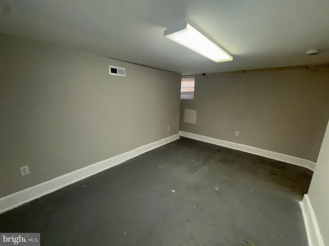 an empty room with a empty space and window