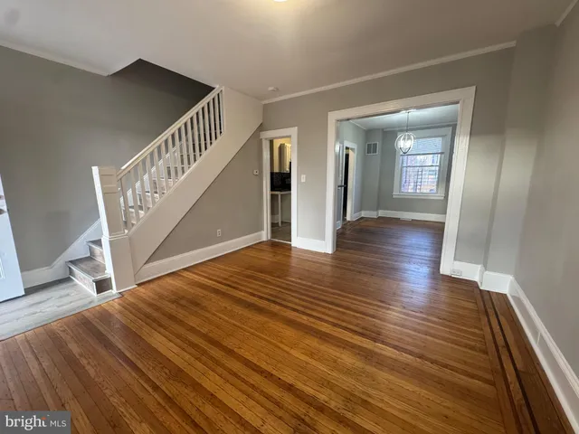 a view of an entryway with wooden floor
