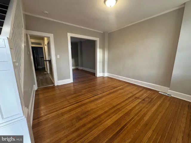 wooden floor in a hall with an entryway