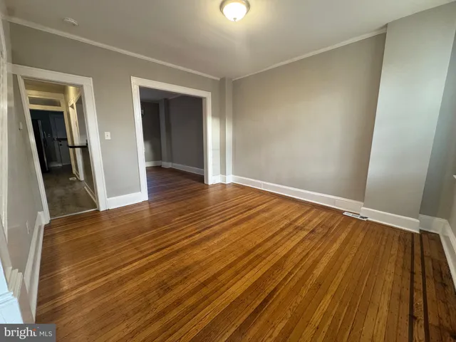 wooden floor in a hall with an entryway