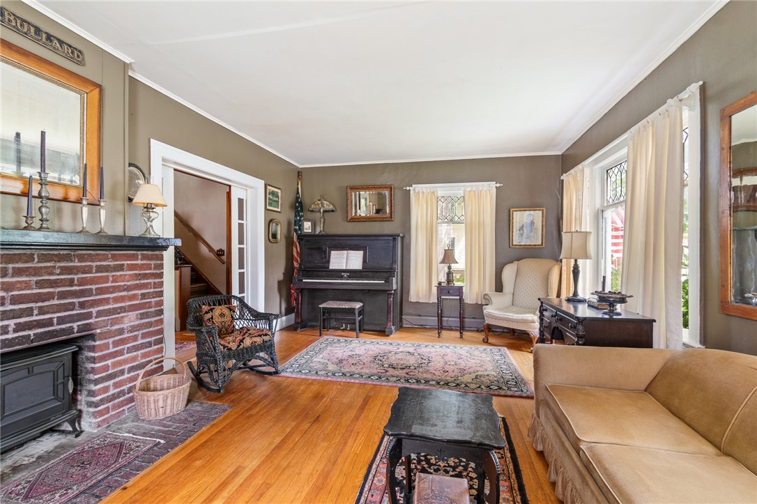 4007 Ridge Road Williamson, NY 14589 - Photo 19 of 34 The LIVING ROOM- the fireplace has a faux insert for a comfortable glow while relaxing here