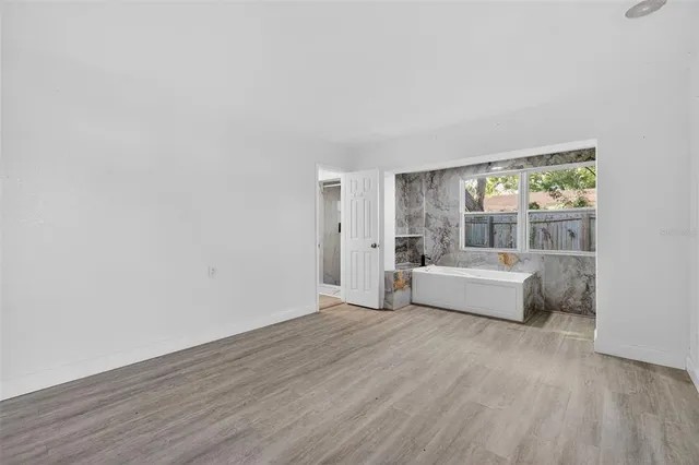 a bathroom with a sink a mirror and vanity