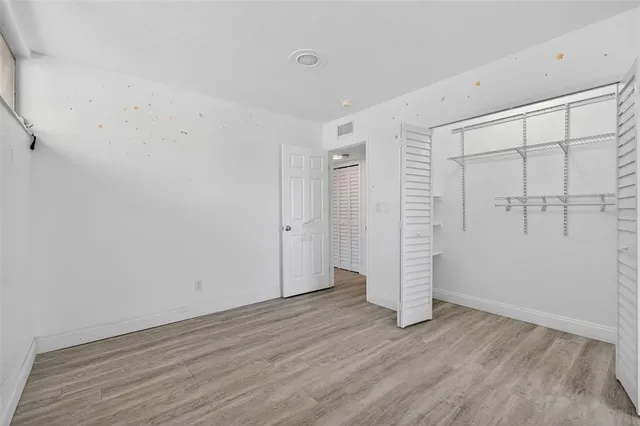 a bathroom with a shower curtain and a sink