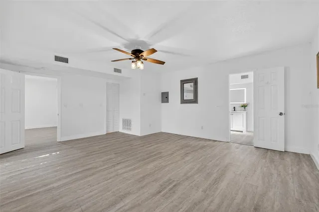 a view of a kitchen with microwave and cabinets