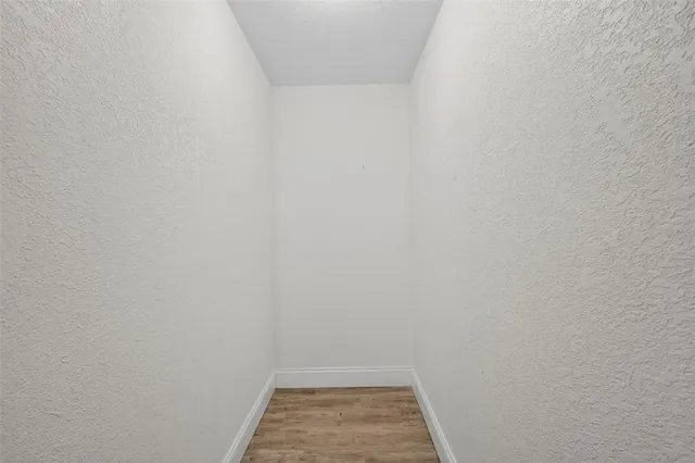 a kitchen with stainless steel appliances kitchen island granite countertop a stove a sink and a microwave