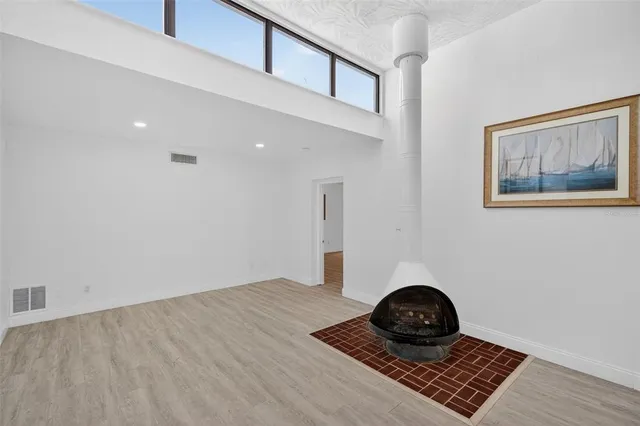 a kitchen with granite countertop a refrigerator stove and sink