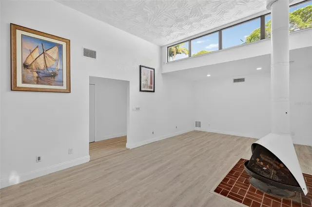 a view of a balcony with wooden floor