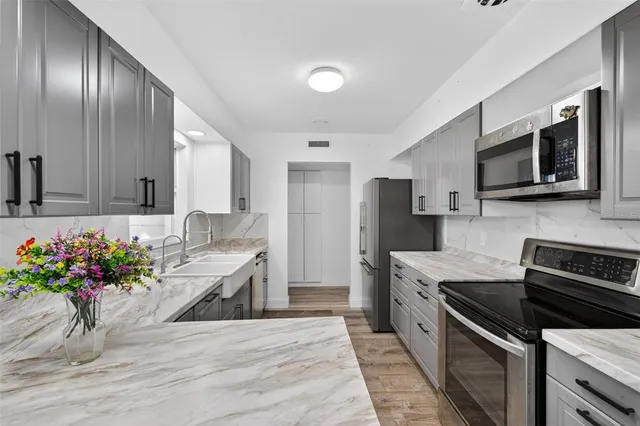 a view of a swimming pool with a patio