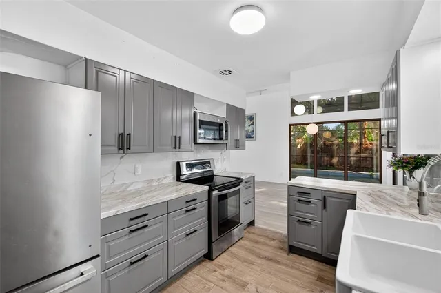 a view of a backyard with pathway