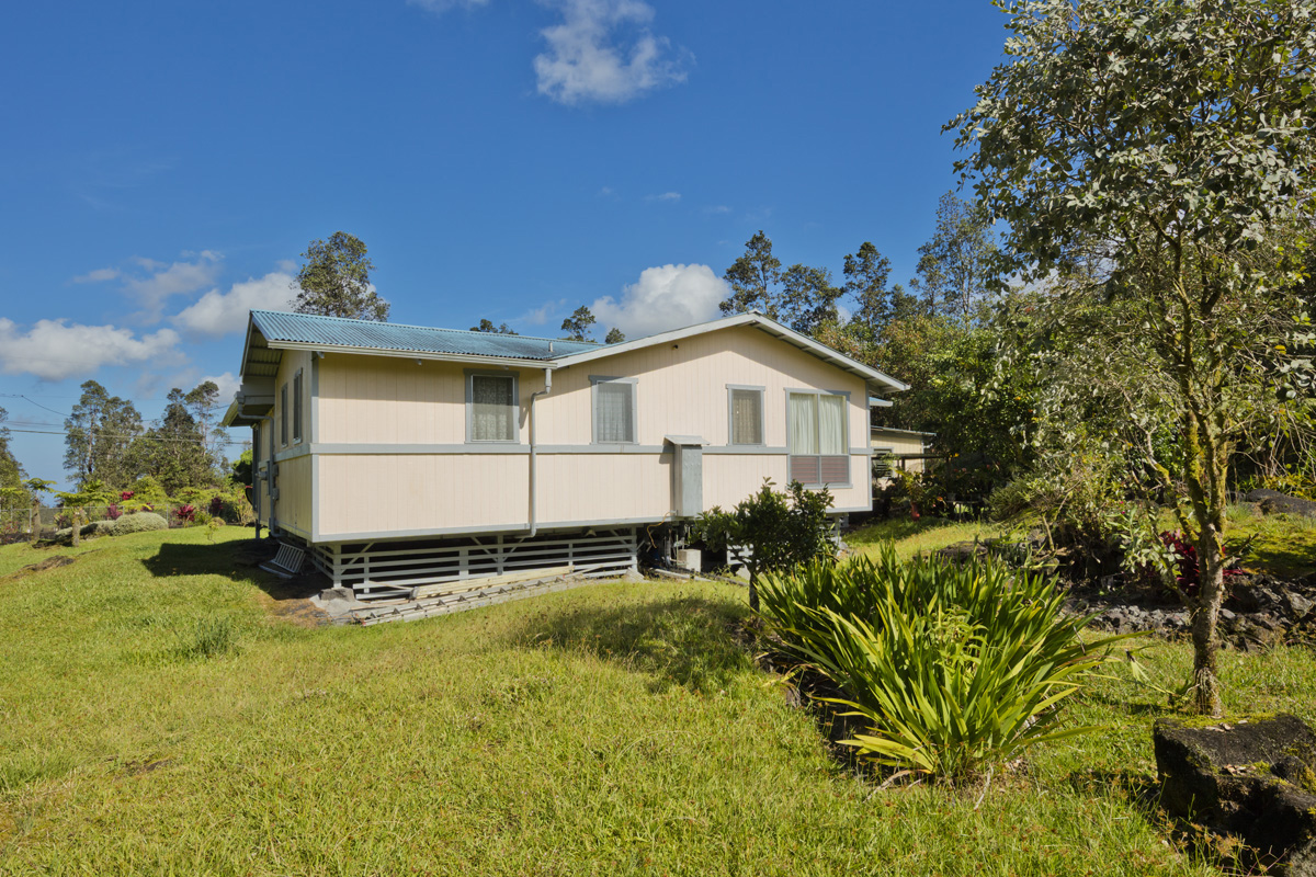 11-3545 Pikake Street Mountain View, HI 96771 - Photo 17 of 30 a front view of a house with a yard