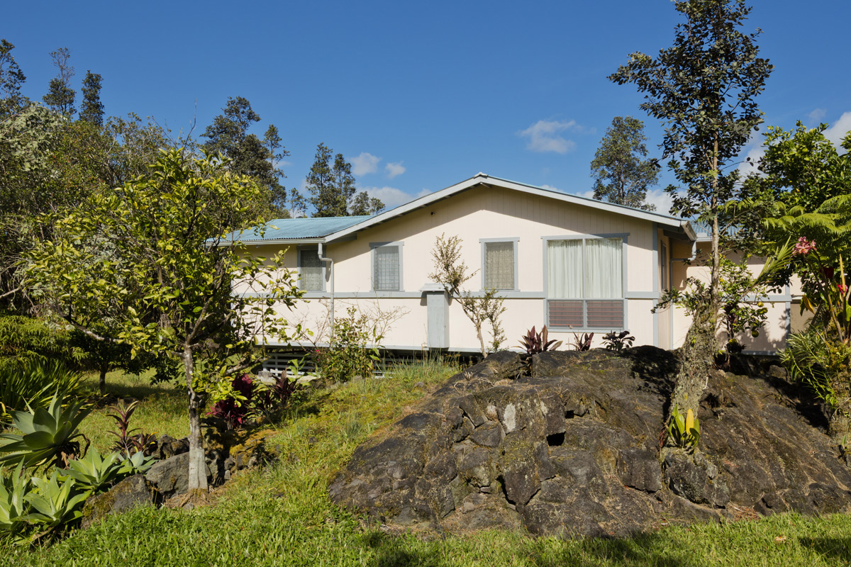 11-3545 Pikake Street Mountain View, HI 96771 - Photo 18 of 30 a blue house with trees in the background