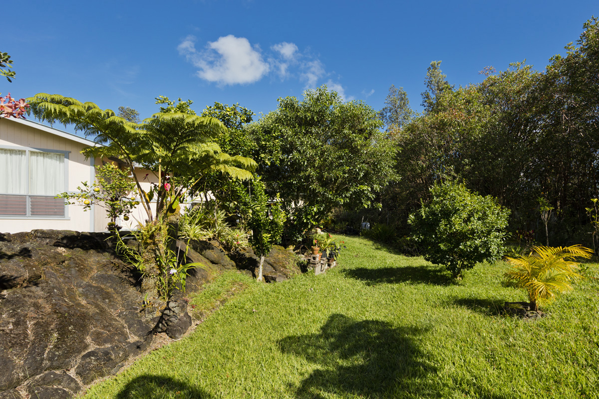 11-3545 Pikake Street Mountain View, HI 96771 - Photo 19 of 30 a view of a house with a yard