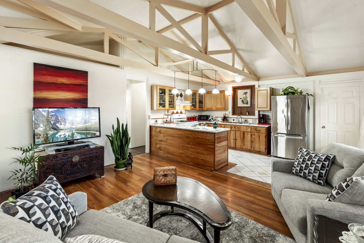 11-3545 Pikake Street Mountain View, HI 96771 - Photo 3 of 30 a living room with furniture kitchen view and a large window