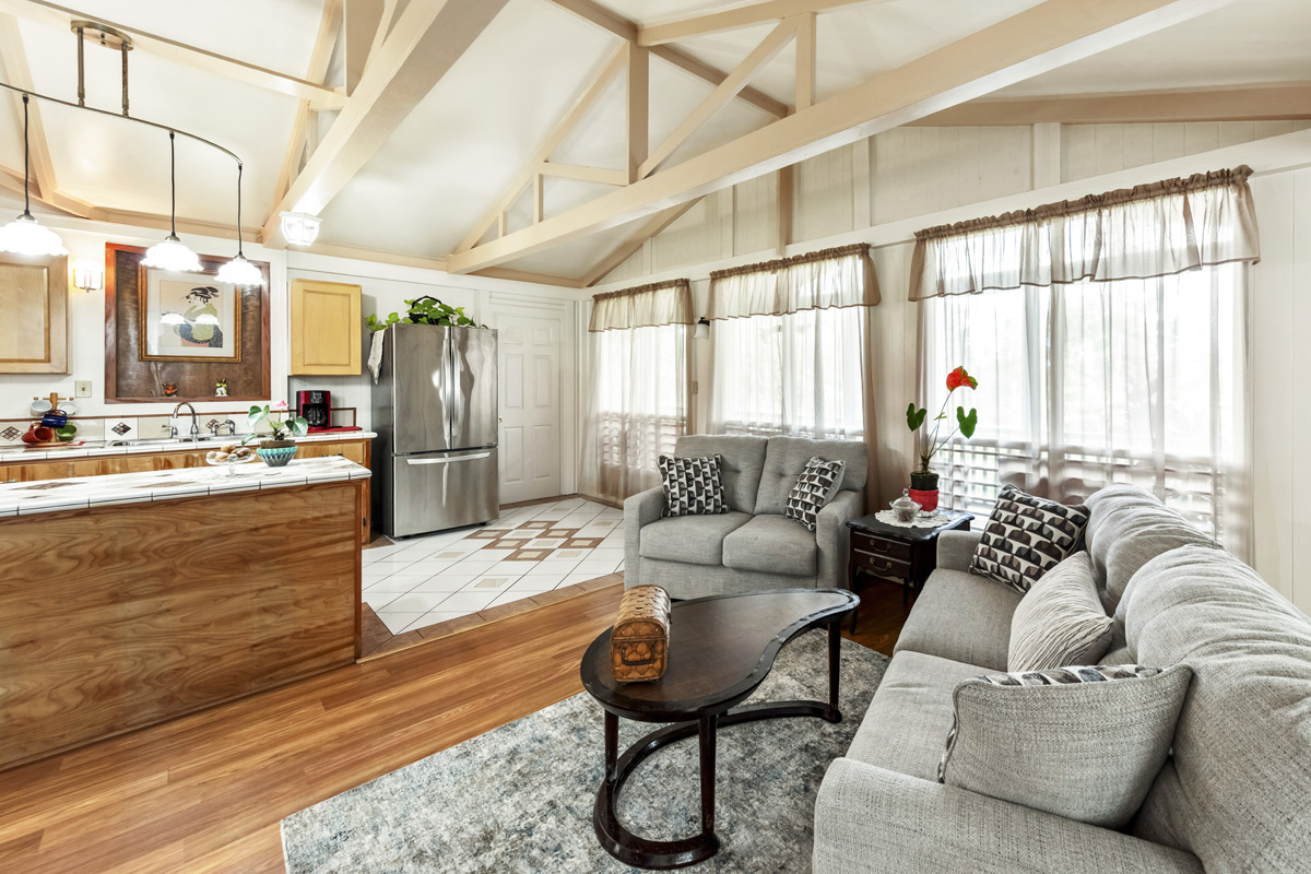 11-3545 Pikake Street Mountain View, HI 96771 - Photo 8 of 30 a living room with furniture and a large window